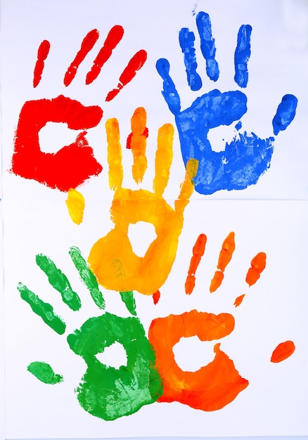 Photo hand prints of paint on white background