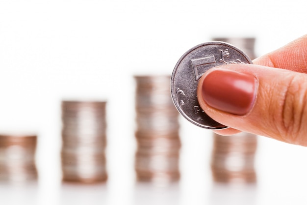 Hand put coin to money staircase