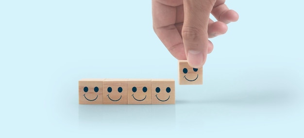 Hand putting wooden cube blocks