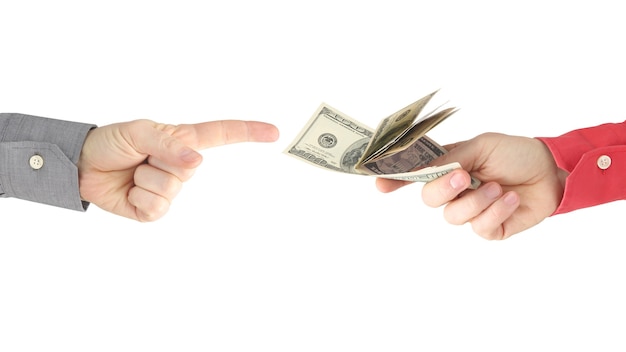 the hand reaches for the hand with the money. payment for work. business and pay. business relations. wealth and poverty
