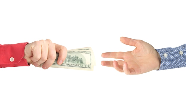 the hand reaches for the hand with the money. payment for work. business and pay