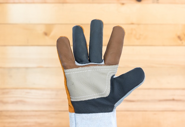 Hand in rough leather glove