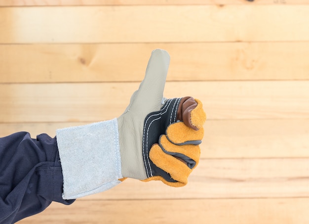 Hand in rough leather glove