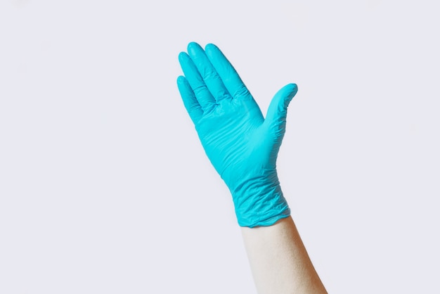 hand in rubber glove shows gestures