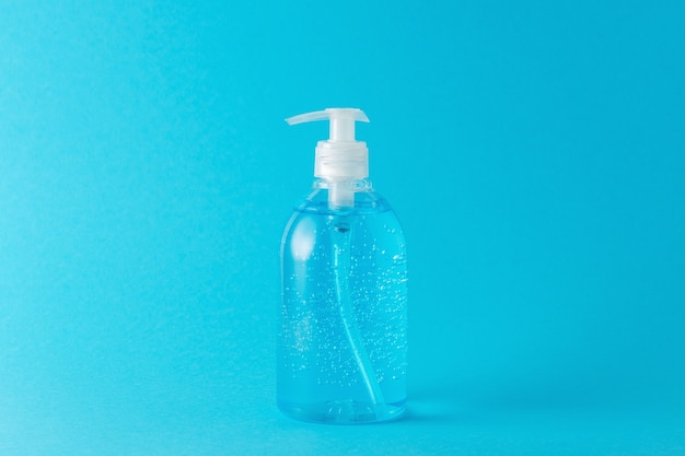 Hand sanitizer in a bottle on a bright background.