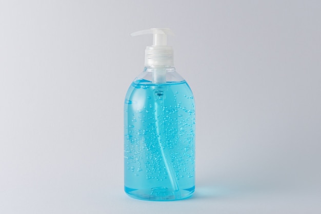 Photo hand sanitizer in a bottle on a bright scene