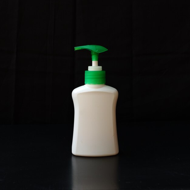 Hand sanitizer isolated on a black background