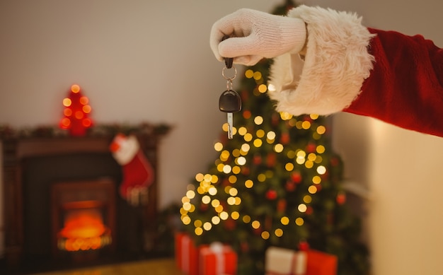 Hand of santa holding car key 