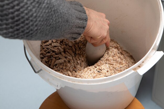 Hand scoop wood pellets