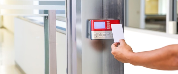 Hand security man using ID card on access control