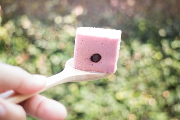 Hand on serving Thai steamed cotton cake