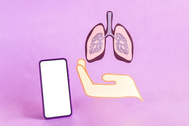 Hand show lungs figure and smart phone with blank screen