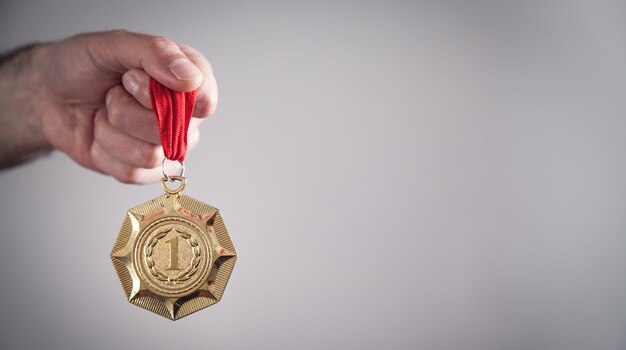 Hand showing medal