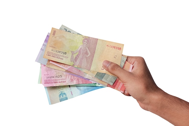 Photo hand showing rupiah money isolated on white background. indonesian money concept