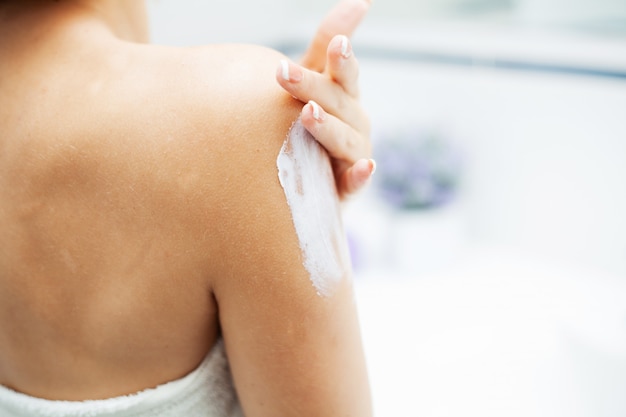 Hand Skin Care. Close Up Of Female Hands Holding Cream