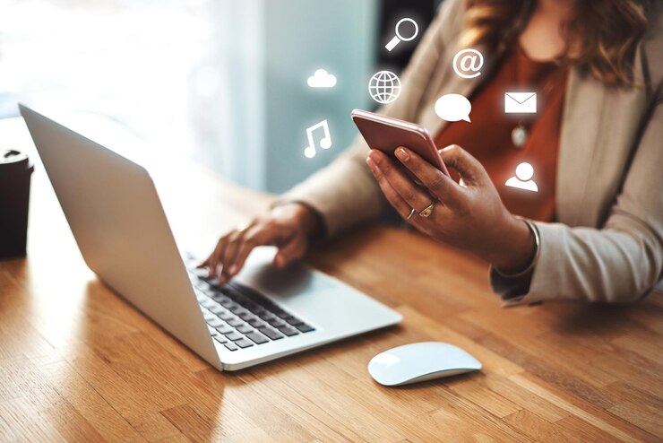 Photo hand smartphone and hologram icons with app for email chat and cloud computing for person in office employee phone and laptop with symbol at job with social network contact and music streaming