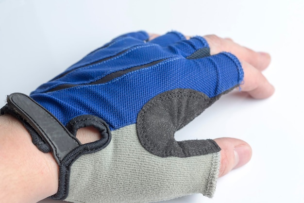 Hand in a sports glove on a white background