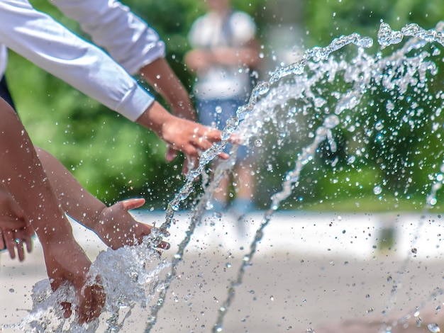 Hand in spray fountain