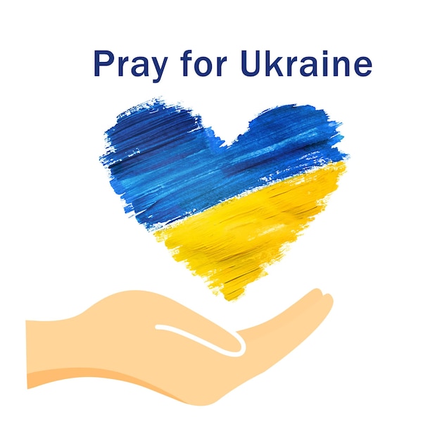 The hand supports the Ukrainian flag in the shape of a heart the concept of peace in Ukraine pray for Ukraine