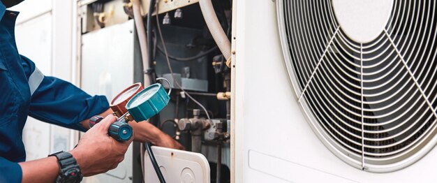 Photo hand technician using manifold gauge checking refrigerant air conditioner