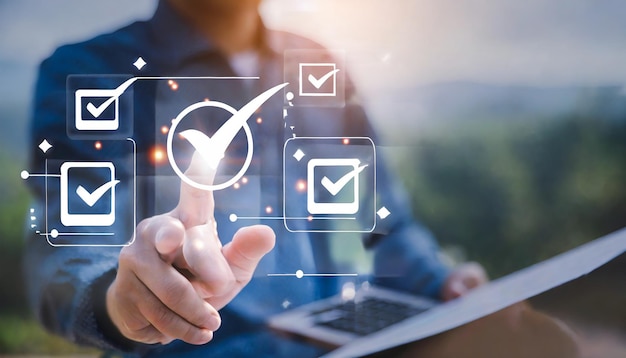 hand tick correct sign mark on virtual checklist for quality control and assurance of ISO concept