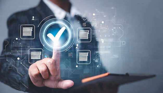 hand tick correct sign mark on virtual checklist for quality control and assurance of ISO concept