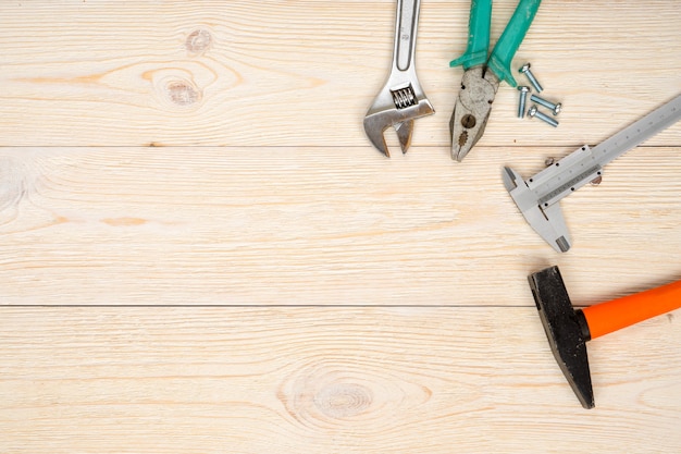 Hand tools on wooden planks