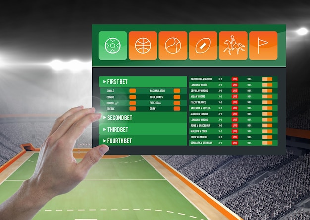 Photo hand touching a betting app interface stadium