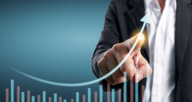 Hand touching  graphs of financial indicator and accounting market economy analysis chart