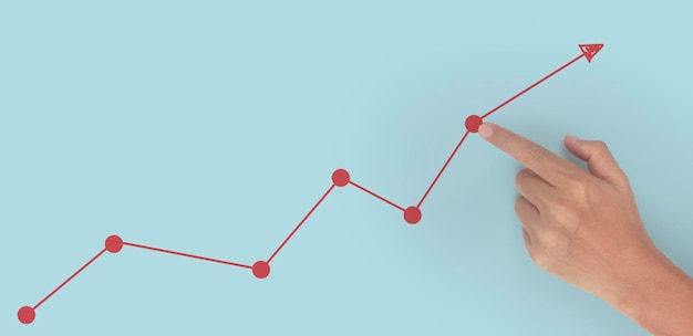 Photo hand touching graphs of financial indicator and accounting market