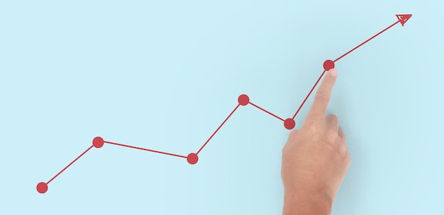 Hand touching graphs of financial indicator and accounting market