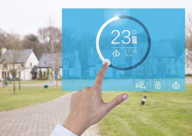Hand touching a Home automation system temperature App Interface