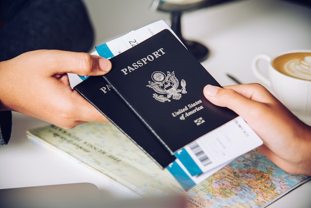 Hand for tourist holding passport to authorities