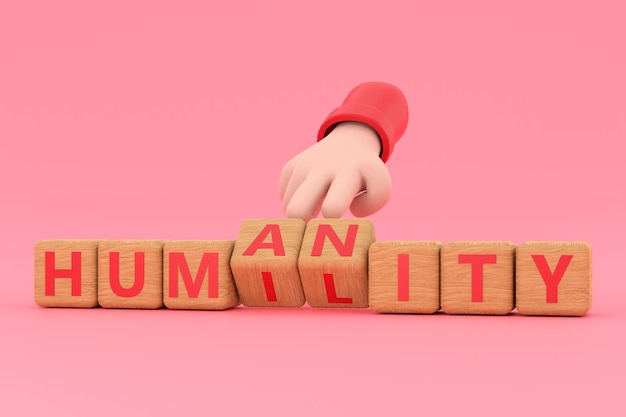 Hand turns dice and changes the word humanity to humility
