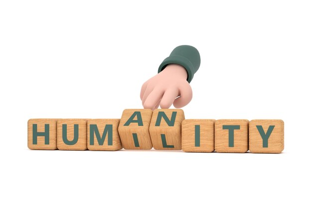 Photo hand turns dice and changes the word humanity to humility