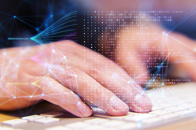 a hand typing on a keyboard with digital network and binary code overlay symbolizing technology and data processing on a bokeh background