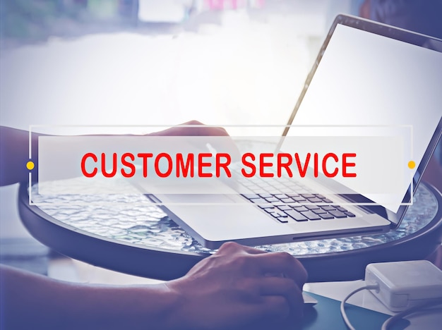 Hand Typing on keyboard with text CUSTOMER SERVICE