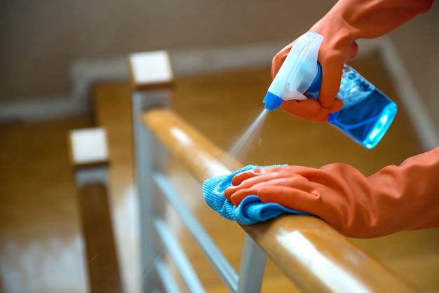 Hand use a wet spray and cloth to clean the wooden railings, disinfectants, cleanliness and health care