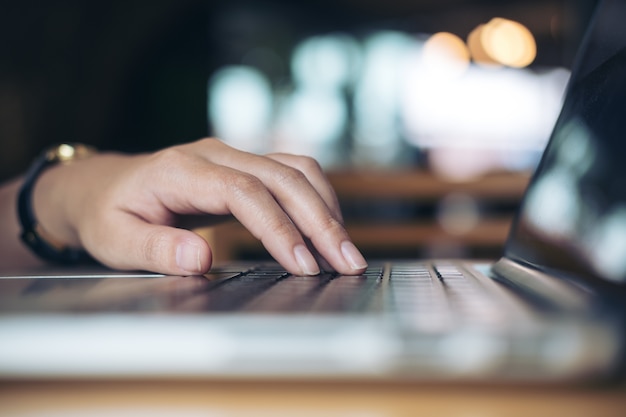 Hand using computer laptop