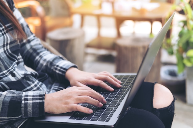 Hand using computer laptop