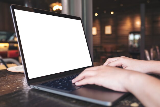 Hand using mockup computer laptop