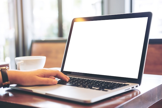 Hand using mockup computer laptop