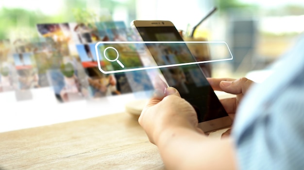 Photo hand using phone with searching bar on screen.  data networking concept