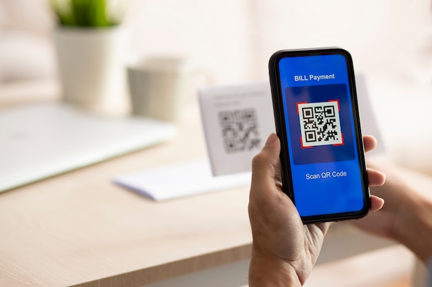 Photo hand using a smartphone to scan a qr code