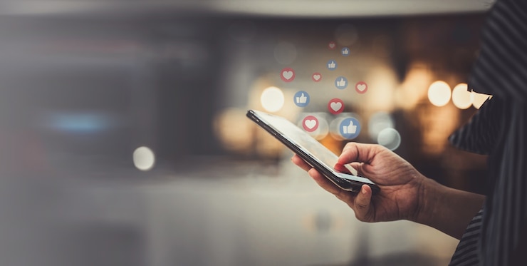 Photo hand using smartphone with social media concept.