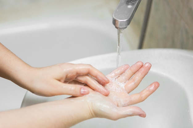 Hand washing under water with soap, disease prevention