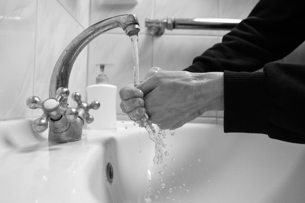 Hand washing with soap and water to prevent coronavirus Hand washingblack and white photo