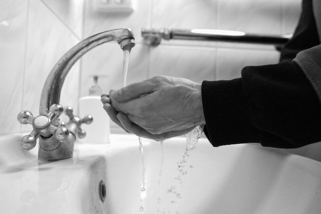 Hand washing with soap and water to prevent coronavirus Hand washingblack and white photo