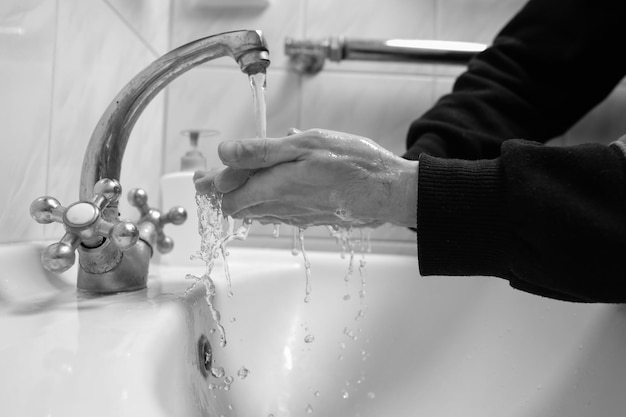 Hand washing with soap and water to prevent coronavirus Hand washingblack and white photo