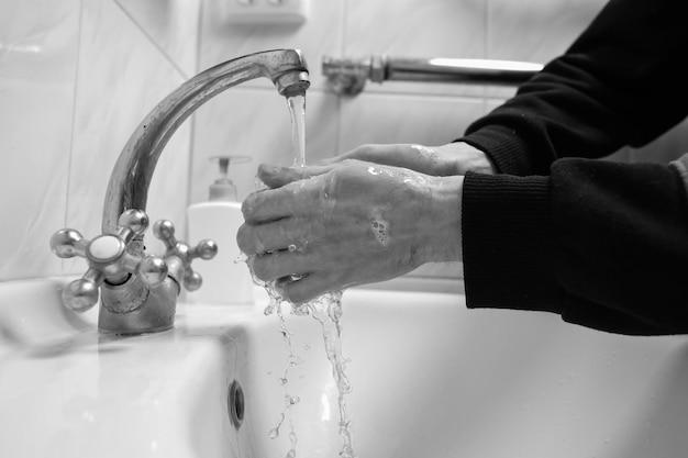 Photo hand washing with soap and water to prevent coronavirus hand washingblack and white photo